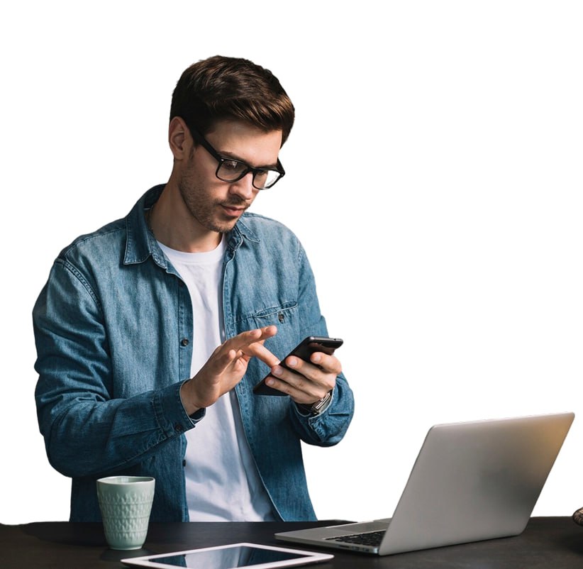 Professional man using smartphone with laptop